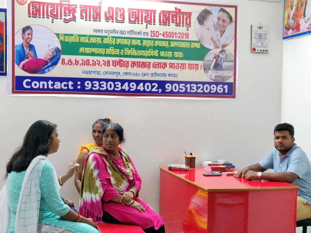 Staff at the Soendri Nurse and Aya Centre office in Nowapara, Sonarpur, discussing home care with a family